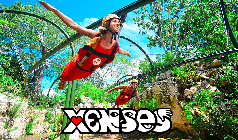 niños en parque xenses en tirolesas